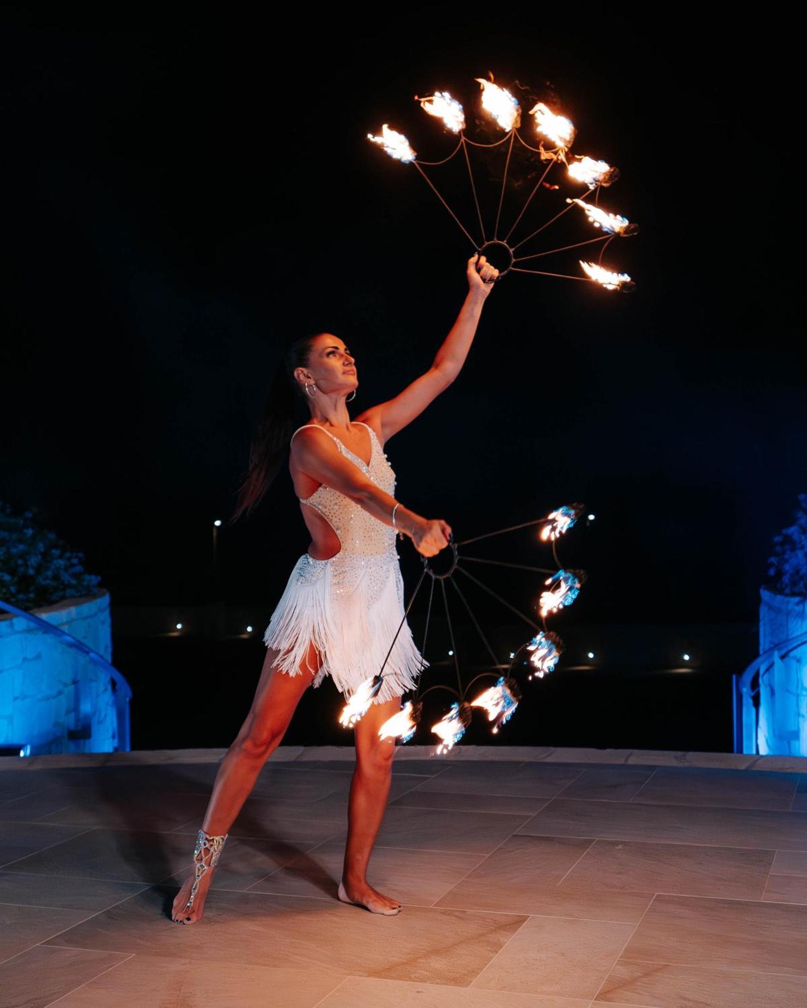 City Of Dreams Mediterranean - Integrated Resort, Casino & Entertainment Limassol Ngoại thất bức ảnh A woman performing with a fire fan